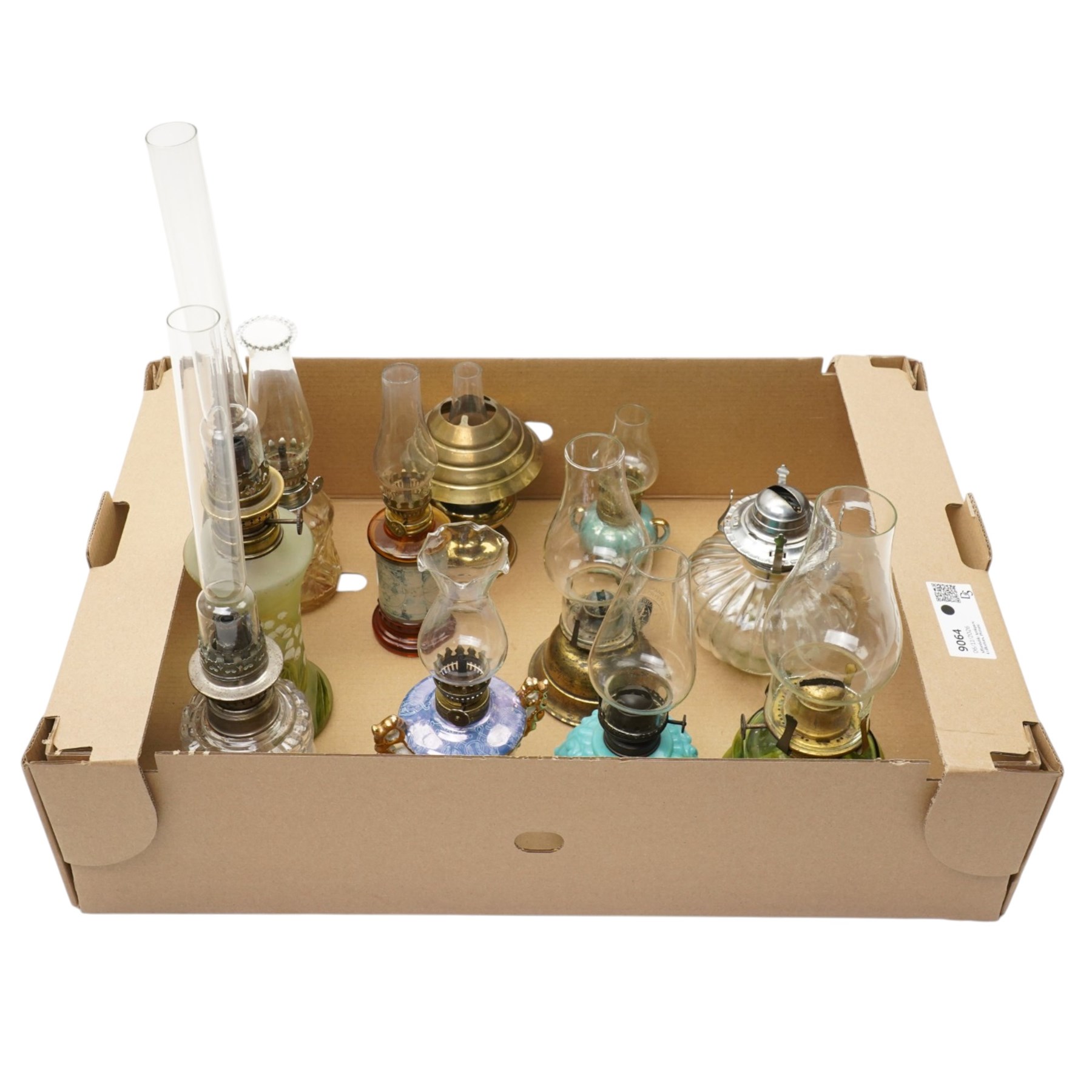 Small table oil lamp with painted glass base and various other small glass and ceramic oil lamps
