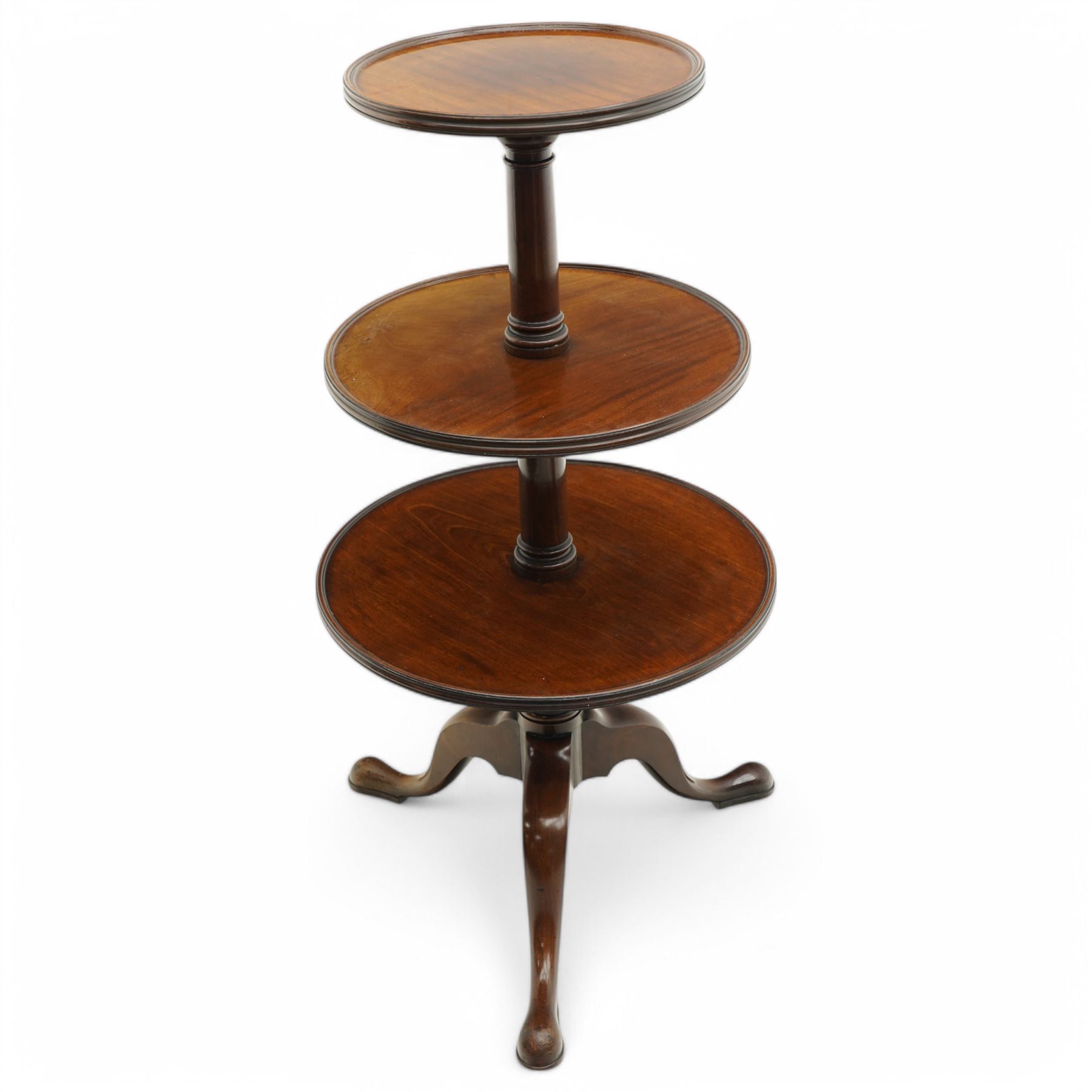George III mahogany tripod dumb-waiter, three graduating tiers with moulded and lipped edges, on ring turned barrel pedestal supports, on three out-splayed supports 