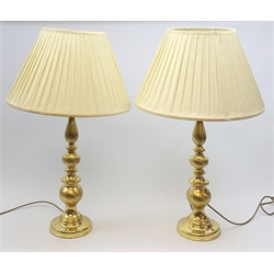 A pair of large gilt effect table lamps with knopped stems, with cream pleated shades, overall H84cm. 