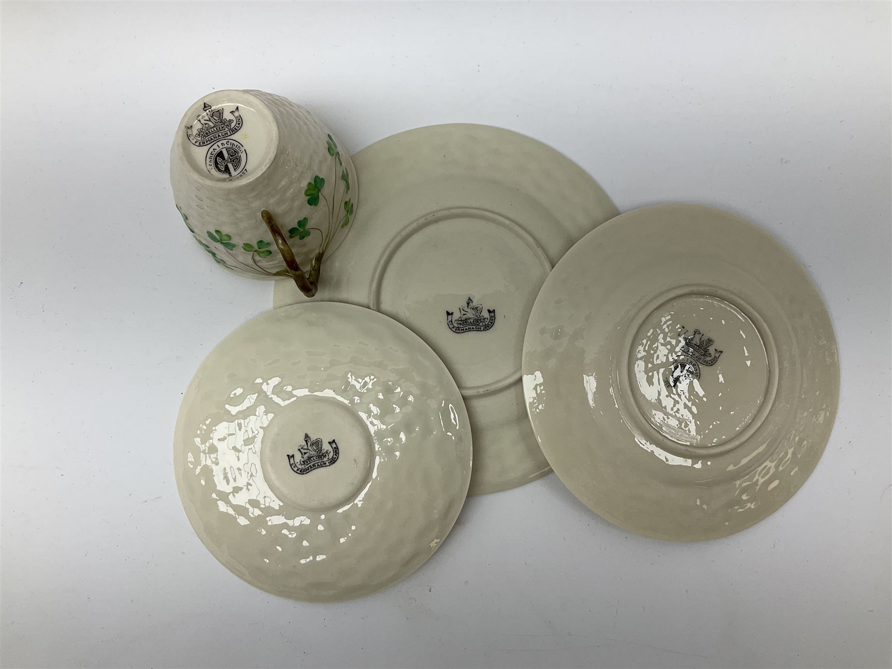 Two Royal Crown Derby pattern Imari soup bowls, pattern 2451, Belleek Fermanagh Ireland four piece set in green shamrock pattern, Royal Doulton small lady figure, Marie HN1370, large Wedgwood fruit bowl, Sylvac jardiniere in autumn leaves pattern, five pieces Co-operative Society commemorative ceramics, with selection of other ceramics. 