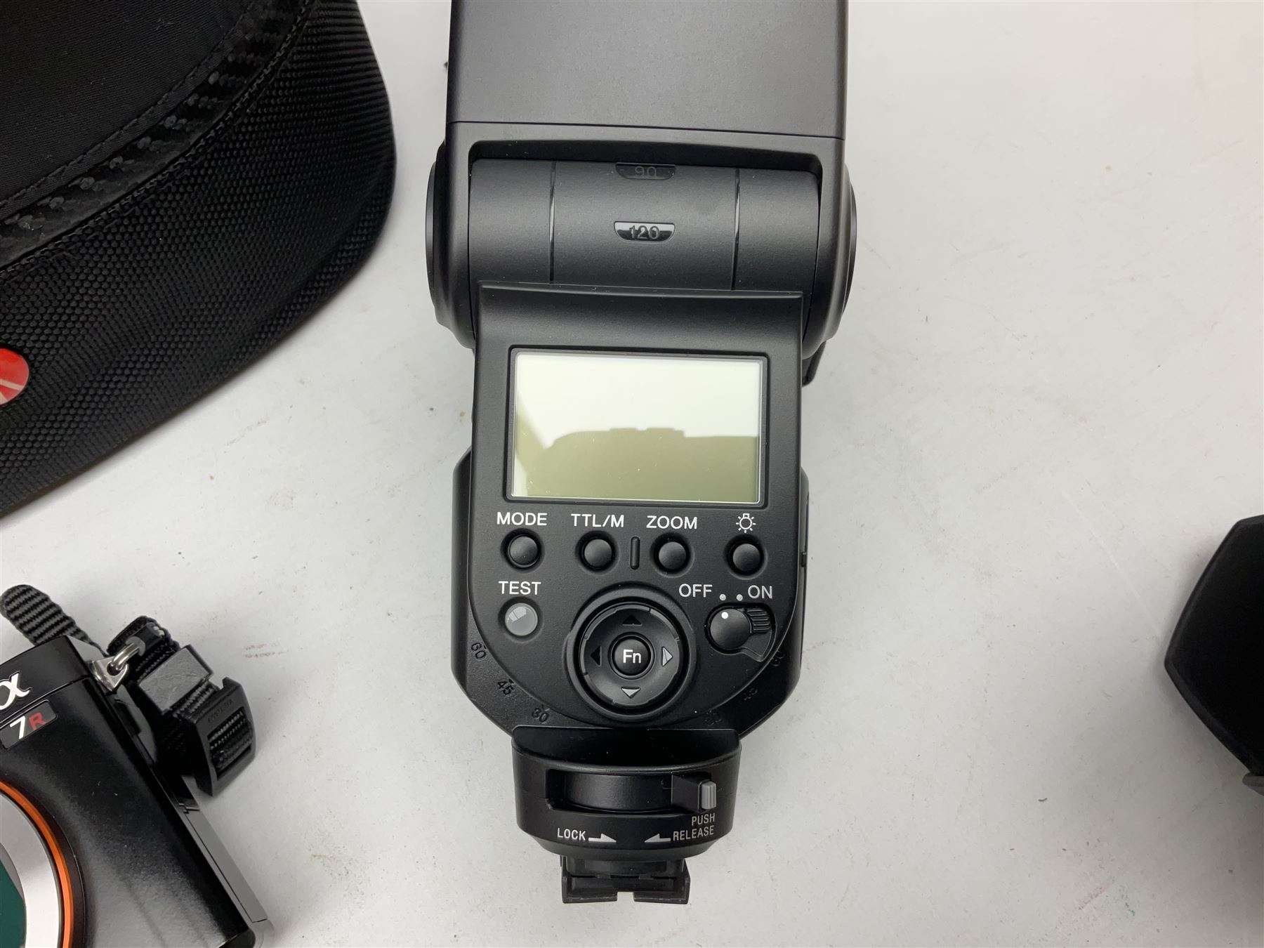 Sony Alpha 7R ILCE-7R camera serial number 3985636, with a 'Carl Zeiss Sonnar FE 1.8/55 ZA' lens, 'FE 28mm F2' lens, Sony Handycam Cyber-Shot HVL-F43M, all with original boxes, together with a Manfrotto camera bag  