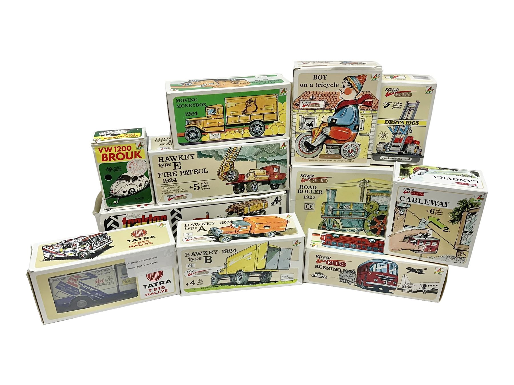 Kovap - eleven tinplate models to include Tractor and Trailer, Road Roller 1927, Moving Moneybox 1924, Hawkeye type B 1924, Boy on a Tricycle; all in original boxes 