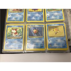 Collection of Pokemon trading cards, mostly 1999 Wizards Pokemon cards to include holo Charizard 4/102, first edition holo Machamp 8/102, further holographic cards; Dark Flareon 35/82 and Dark Vaporeon 45/82, cards from themed sets and 4th edition prints; 1998 Electronic Pokédex with cardboard boxes for themed decks Blackout, Overgrowth and Power Reserve Jungle, along with a large quantity of energy and trainer cards 