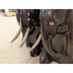 Pair of carved elephant bookends with bone tusks, H14.5cm