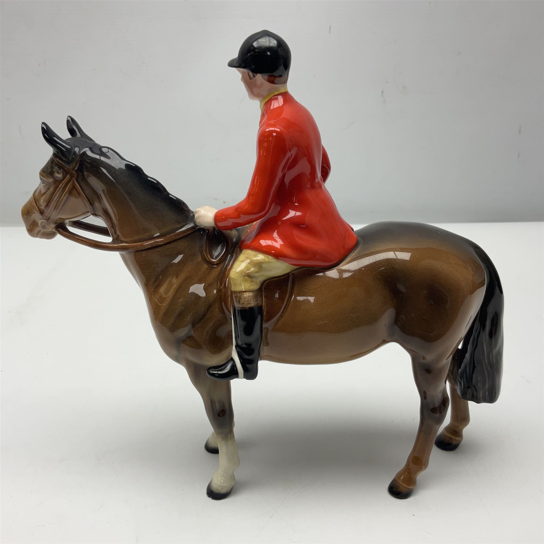 Beswick huntsman upon a bay horse no. 1501, with printed mark beneath, H22cm