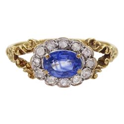  9ct gold oval sapphire and diamond cluster ring, with split design shoulders, London 1987, sapphire approx 0.60 carat