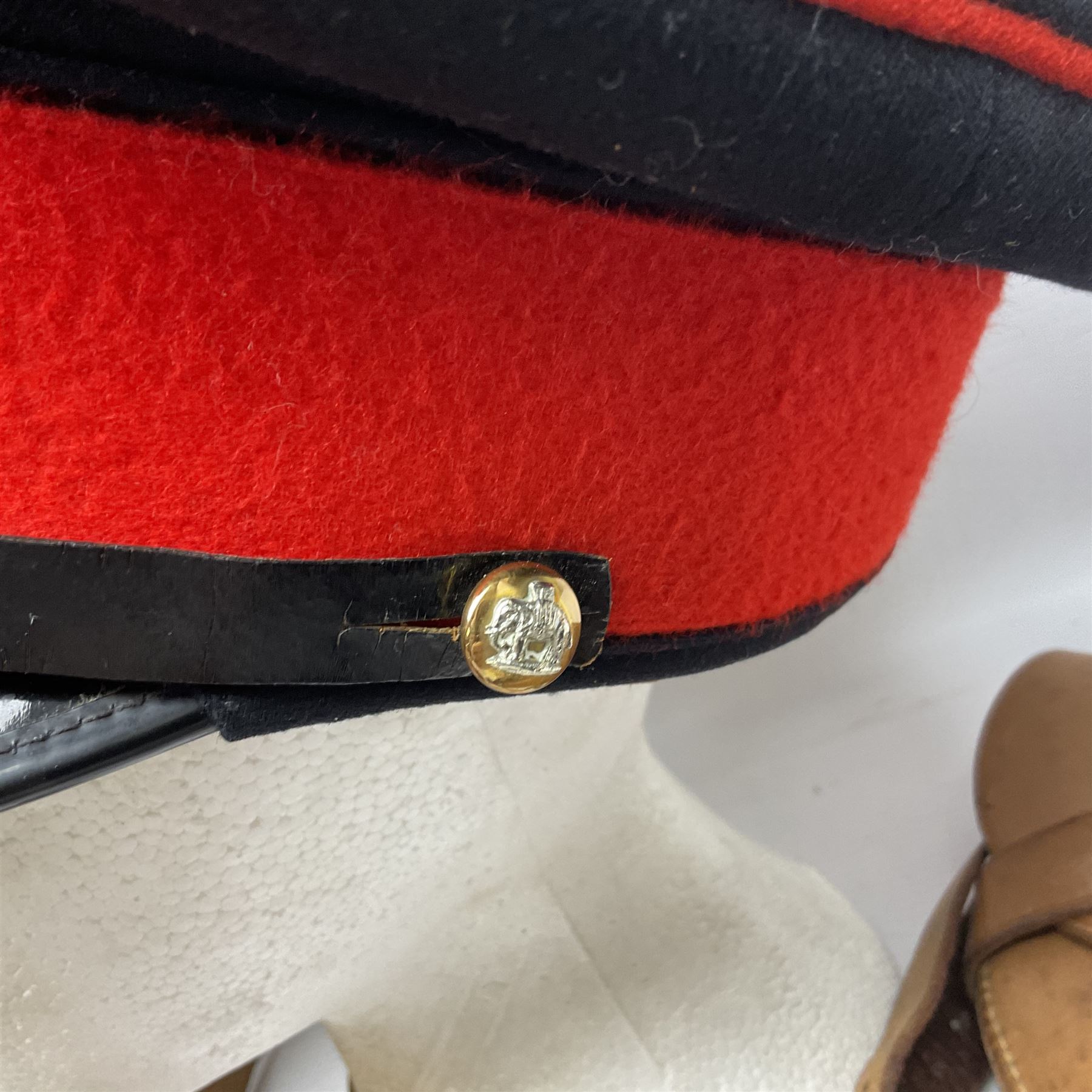 British Army General Staff officer's peaked cap by Herbert Johnson London in Moss Bros. delivery box; two officer's Sam Browne leather belts; leather pistol holster and sword hanger; pair of leather gloves and pair of spurs