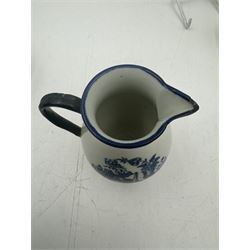 18th century Caughley blue and white sparrow jug, decorated in the Mother and Child pattern, circa 1780-1790, with underglaze C mark beneath, H9cm, together with a Worcester coffee cup, circa 1785 painted with floral sprays in underglaze blue and gilt, with crescent mark beneath, and a Caughley trio of tea cup, tea bowl and saucer, each of moulded wrythen fluted form and decorated with gilt and blue sprigs and bands, each with crescent mark beneath, (5)