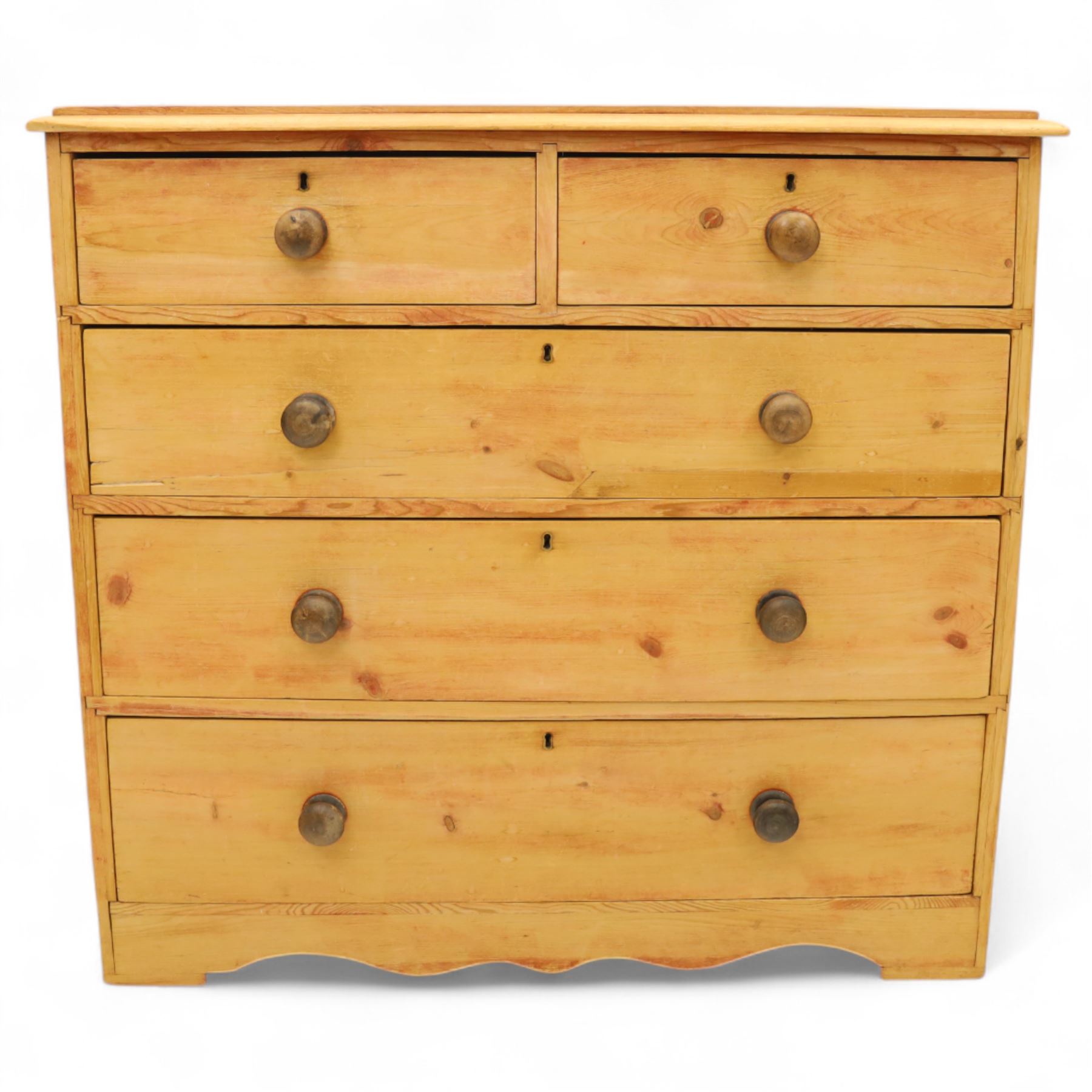 Victorian stripped pine chest, fitted with two short and three long drawers, turned wooden handles, shaped lower apron on bracket feet