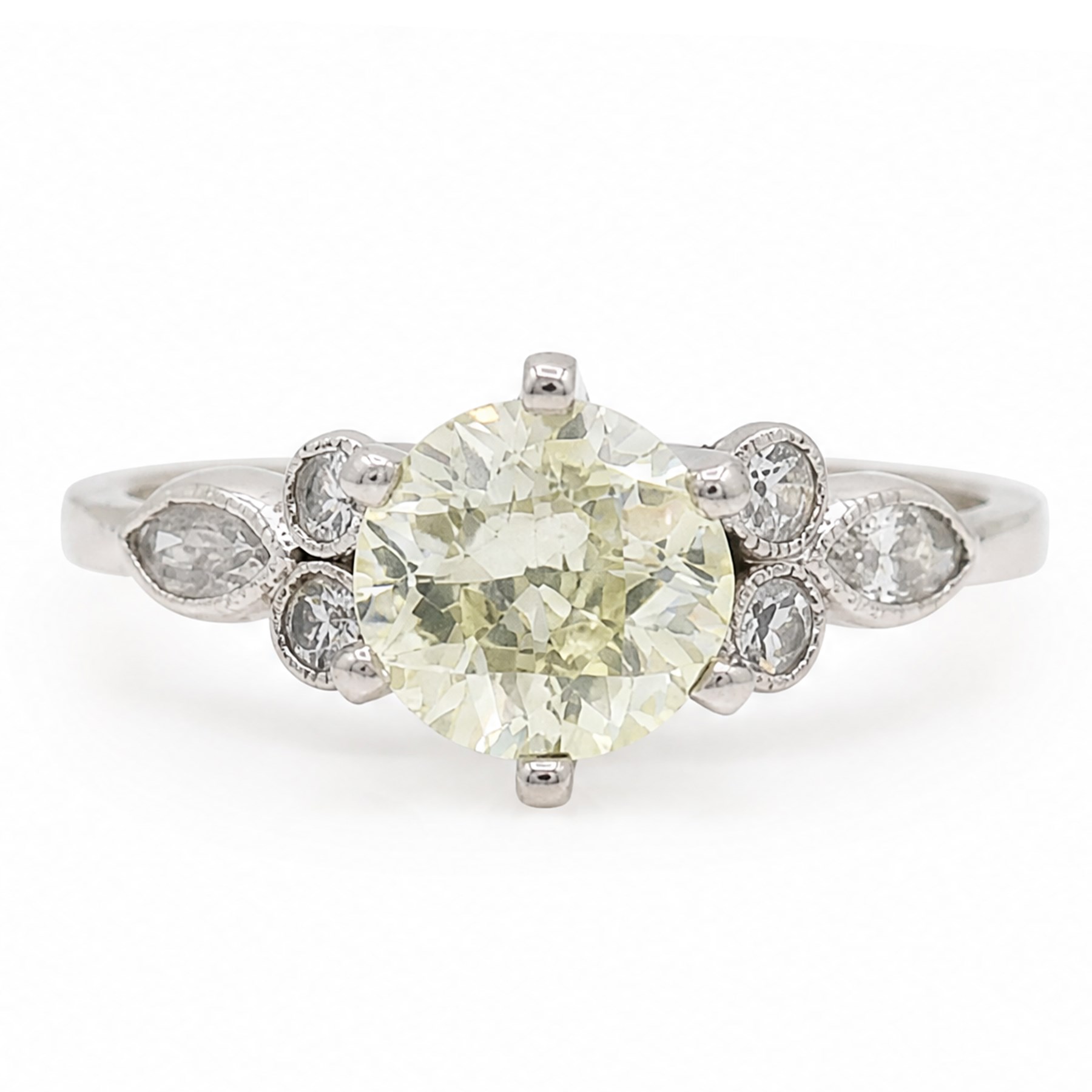 Platinum diamond ring, six claw set with a single old cut diamond of approx 1.35 carat, each shoulder milgrain set with two single cut diamonds and a marquise cut diamond, stamped Plat