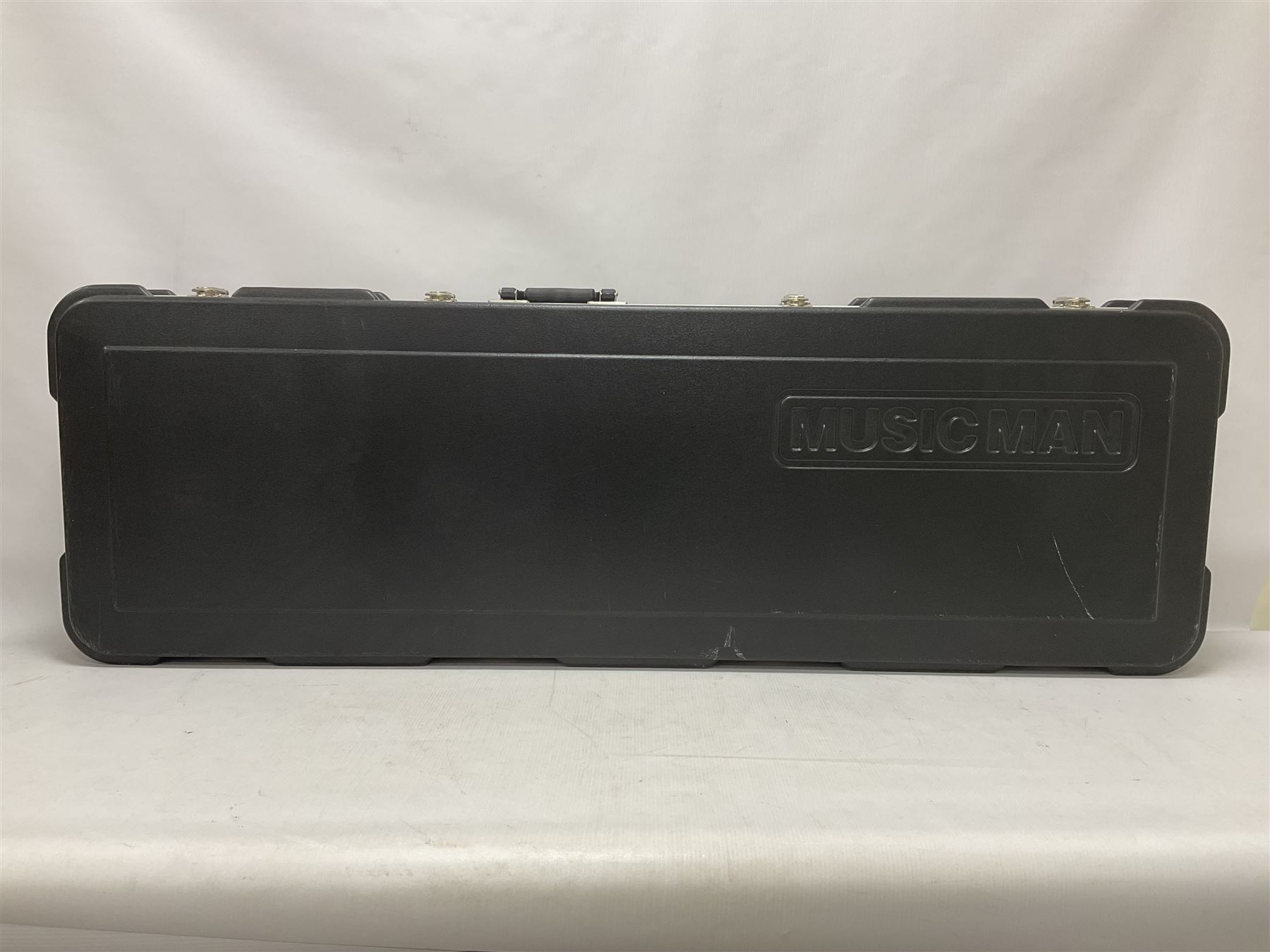 Ernie Ball Music Man Sting Ray 4 string bass guitar, in natural finish with roasted maple neck and tortoiseshell effect scratch guard, serial no 87485, in black Music Man hard case, guitar L114cm