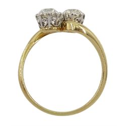 Early 20th century 18ct gold and platinum two stone old cut diamond crossover ring, stamped, total diamond weight approx 1.30 carat