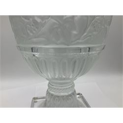 Large and impressive Lalique Versailles pattern glass vase, of classical baluster form with gadrooned flared rim, the body moulded in relief with fruiting vines above part fluting, upon a spreading circular foot with moulded decoration, and plain square plinth base, signed Lalique France to side of plinth, overall H35cm, with original box 