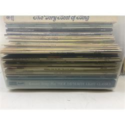Large quantity of vinyl LPs, predominantly rock and pop, to include Elvis, Elton John, The Kinks, Deep Purple, Eurythmics, Whitney Houston, Phil Collins, Rolling Stones etc, in three boxes, together with quantity of 45 rpm records, Steepletone SRP1R-11 record player and record carry case