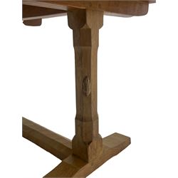 'Rabbitman' oak dining table, rectangular adzed top, on octagonal pillar supports on sledge feet joined by floor stretcher, carved with rabbit signature, by Peter Heap of Wetwang