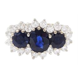 18ct white gold three stone oval and round cut sapphire and round brilliant cut diamond cluster ring, London 1986, total sapphire weight approx 1.80 carat, total diamond weight approx 0.60 carat