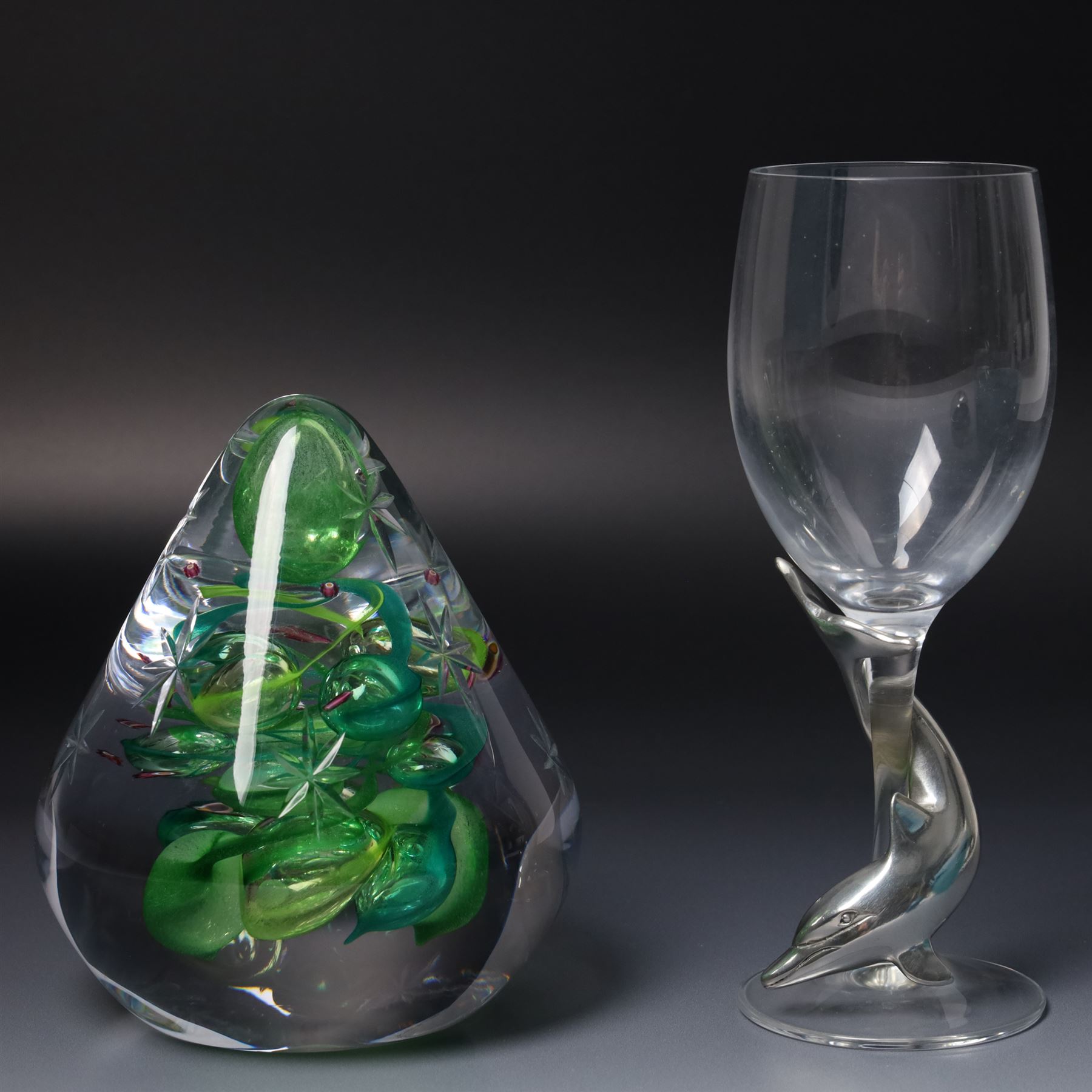 Glassware including Mats Jonasson Signature Collection dolphin sculpture, Swarovski 1990 Annual Edition dolphin model 'Lead Me', two Caithness vases, Caithness 'Christmas Tree' paperweight, Bohemia glass large dolphin model and wine glass with etched decoration, six boxed