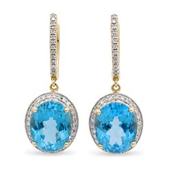 Pair of 14ct gold Swiss blue topaz and diamond pendant earrings, each stud suspending a si...