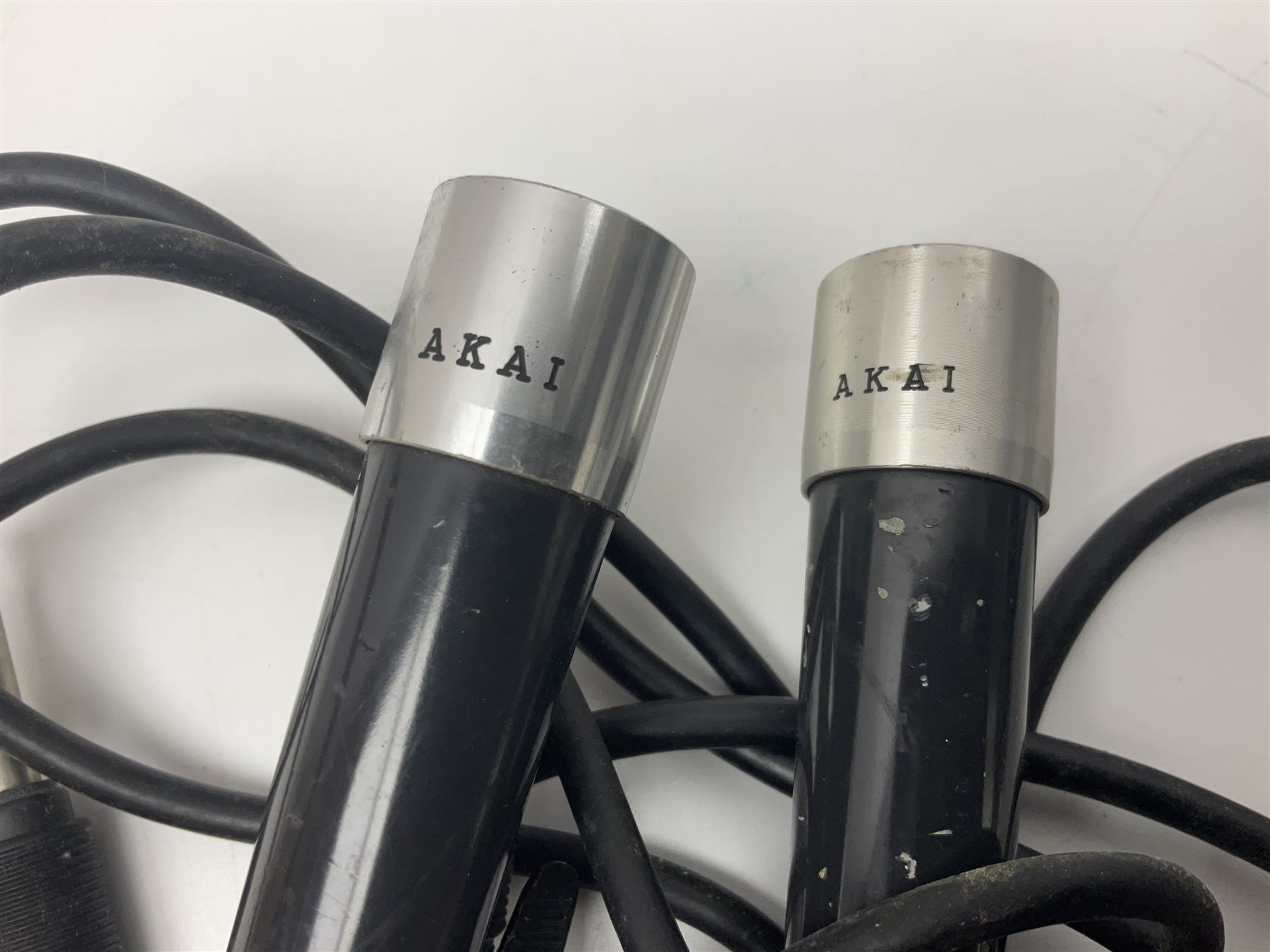 Vintage pair Akai ADM-8 Dynamic microphones; AKG D880 Dynamic microphone; cased; and Shure Betagreen BG1.0 vocal microphone; boxed; all with cables (4)