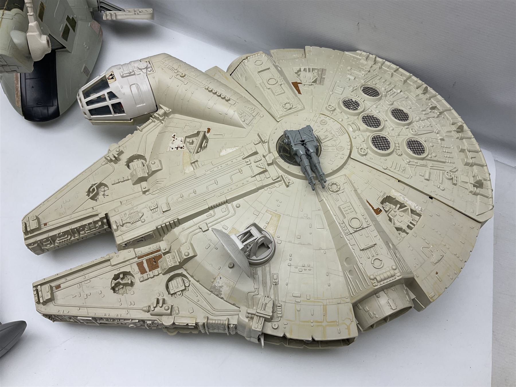 Star Wars - three space vehicles comprising B-Wing fighter and large Millenium Falcon space ship; both with instructions; and Boba Fett Slave 1; all unboxed (3)