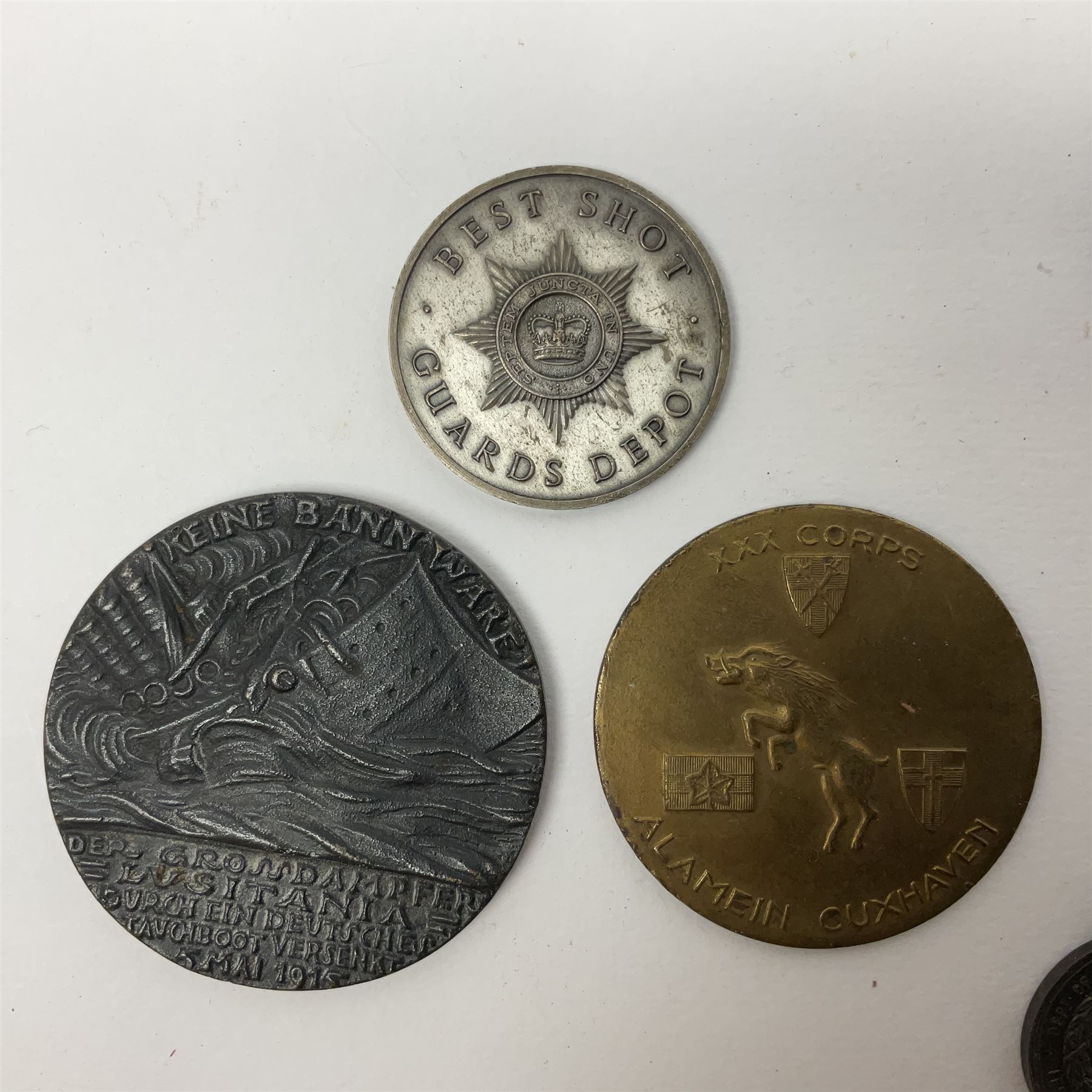 RMS Lusitania iron medallion dated 5th May, 5.5cm diameter, boxed with St Dunstan's Blinded Soldiers Profit paperwork; another unboxed similar Lusitania medallion; 30th Corps Alamein Cuxhaven medallion; Battle of Jutland 1916 silver memorial pendant; Navajo Code Talkers medallion 2000; and five other military related medallions