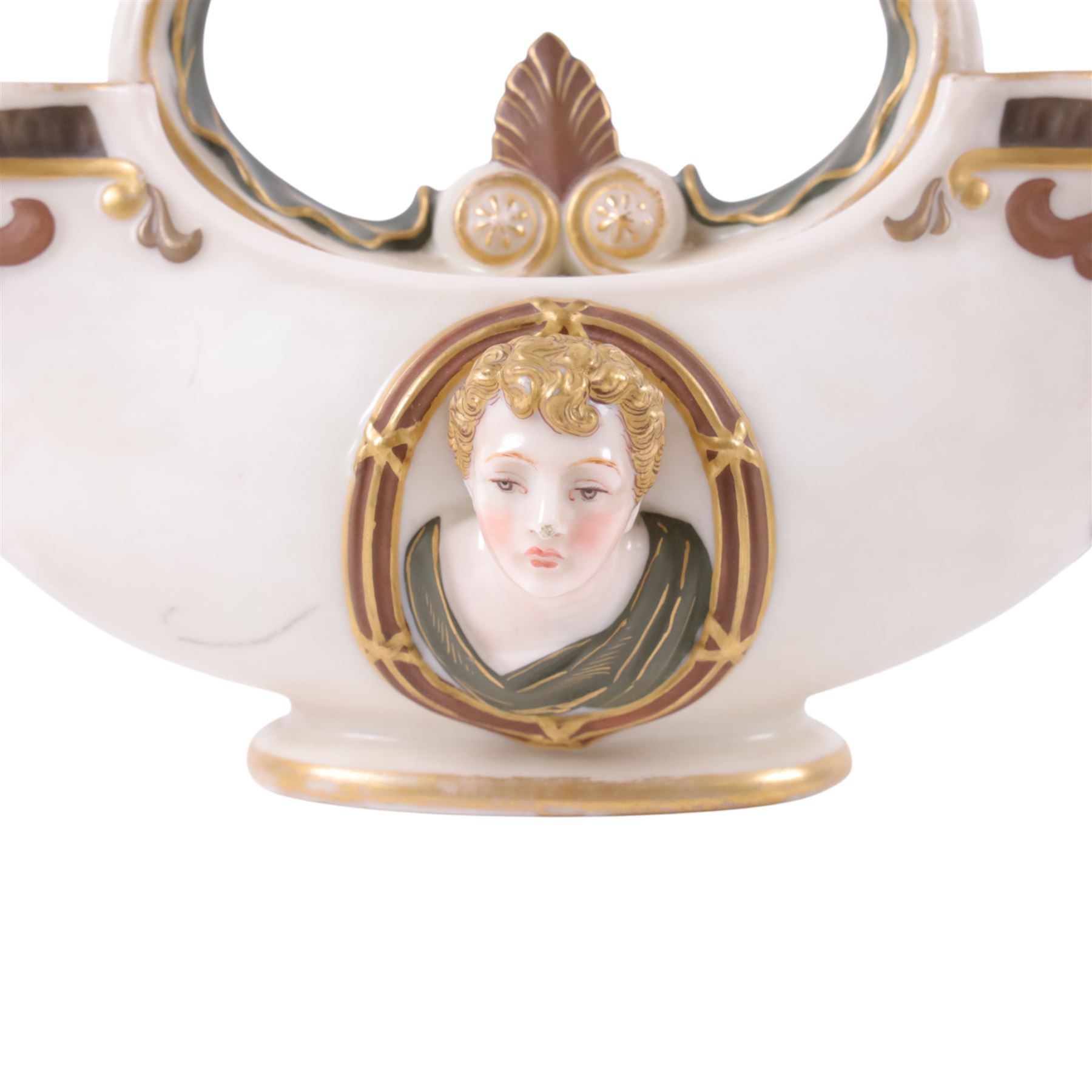 Royal Worcester double-ended vase, modelled in relief with mask panels in the classical dress the central handle with foliate and scroll work, H16cm 
