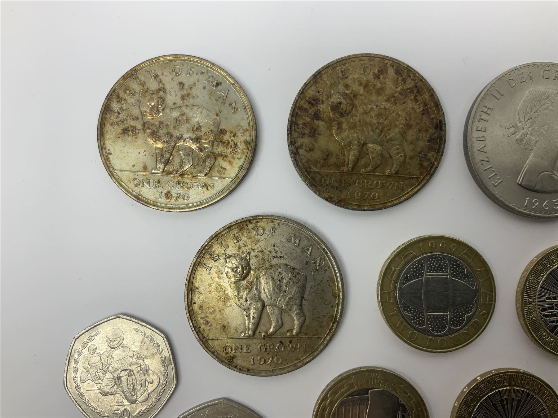 Queen Elizabeth II commemorative coins, including three Isle of Man 1970 crown coins, two further UK 1965 and 1970 crowns, three 2017 ‘Benjamin Bunny’ fifty pence pieces, two 1999 ‘Rugby World Cup’ two pound coins, Isle of Man 1999 ‘Phillip McCallen’ fifty pence piece etc