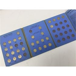 Fourteen part filled Whitman folders, including farthings, halfpennies, pennies and sixpences