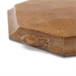 Mouseman - adzed oak breadboard or chopping board, canted rectangular form carved with mouse signature, by the workshop of Robert Thompson, Kilburn 