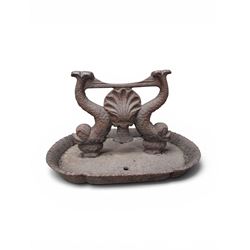 Victorian cast iron boot scraper, supported by two dolphins with central shell motif