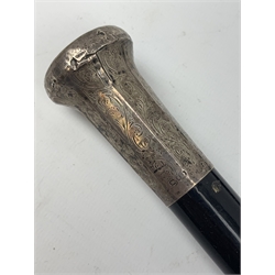 A silver mounted ebonised walking cane, the foliate engraved silver top hallmarked London 1923, maker's mark worn and indistinct, together with a further silver mounted cane, hallmarked London 1923, maker's mark worn and indistinct. 