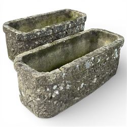 Two cast stone planters / troughs with lion emblems