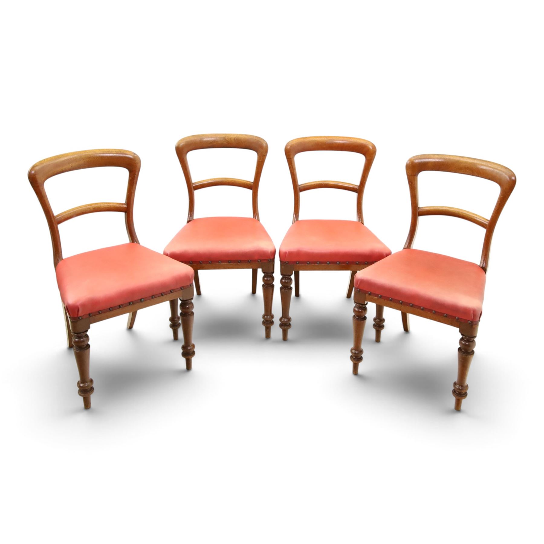 Set of four Victorian mahogany balloon back chairs, with red leather seats 