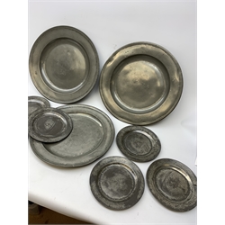 Collection of early 18th century pewter, comprising three large chargers, and seven plates, with various marks and touch marks verso, including the Crowned Rose and shield pseudo 'hallmarks', chargers D46cm and D42cm, plates D23cm.