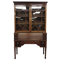19th century mahogany secretaire bookcase, projecting cornice with figured and satinwood inlaid frieze above two astragal glazed doors, the tambour roll top base with inset leather interior and with drawers, square tapering supports with pierced corner brackets and spade feet, W130cm, H217cm, D48cm