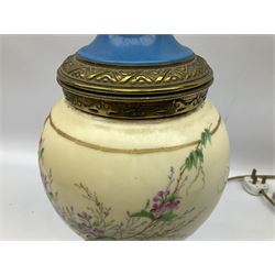 20th century continental, probably French, hand painted ceramic and brass table lamp decorated with flowers and gilt detail upon a footed base, H62.5