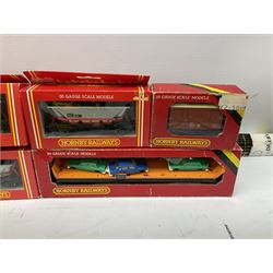'00' gauge - seven Hornby goods wagons including car transporter, hopper wagons, ventilated van etc; all boxed; quantity of Peco track; H & M Duette power controller; layout accessories; signals etc