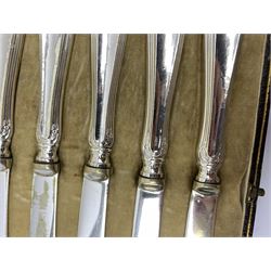 Two silver napkin rings by Collingwood & Sons Ltd, Birmingham 1928 and two other silver napkin rings hallmarked, approx 3.2oz, cased set of silver silver handled knives, hallmarked Sheffield 1915, together with a selection of silver plated flatware, to include Walker and Hall fish eaters set, cased nut cracker set with grape scissors, etc., plus a silver mounted hair brush and hand held mirror, hallmarked Chester 1919