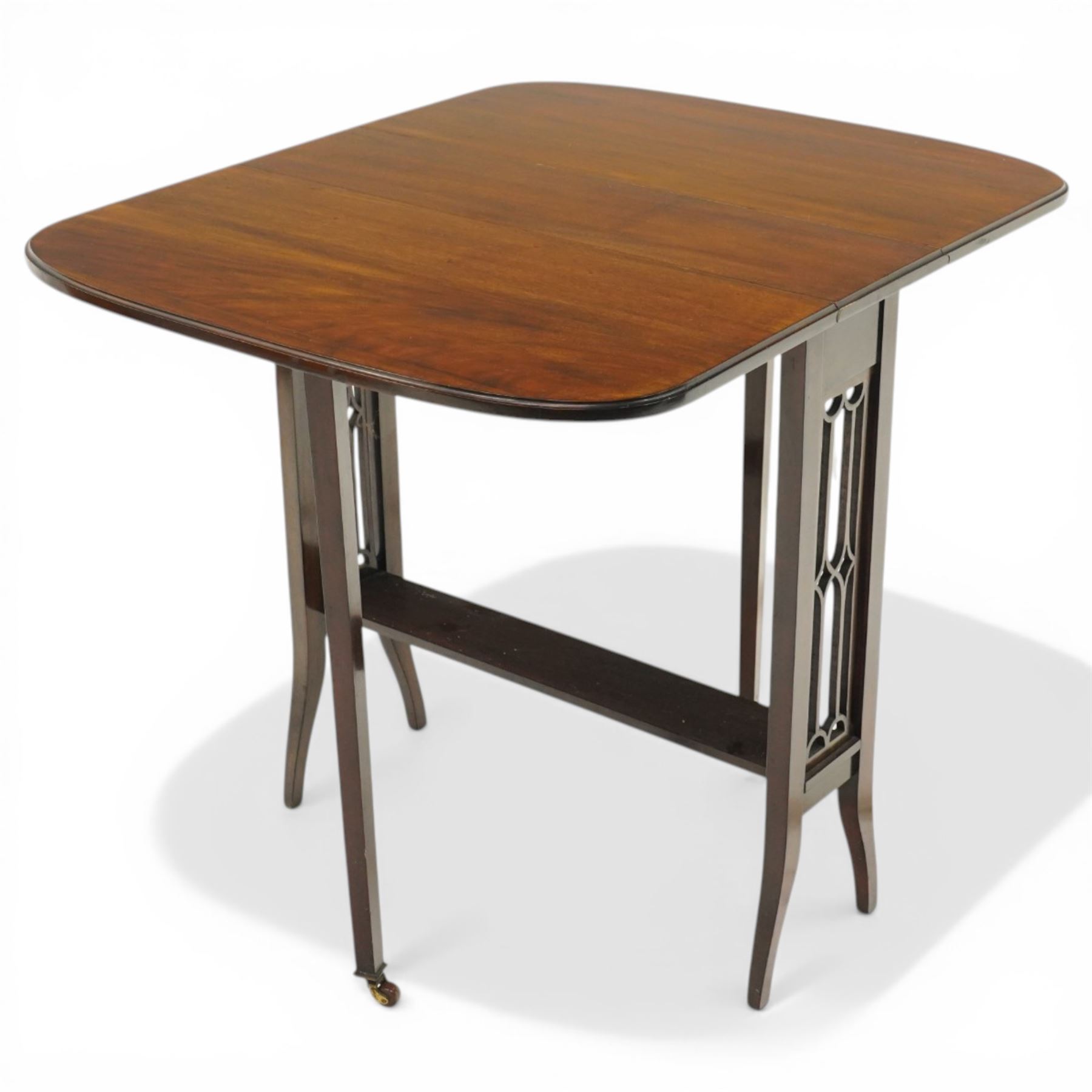 Edwardian mahogany Sutherland table, rectangular drop-leaf top with rounded corners, raised on gate-leg base with pierced end supports
