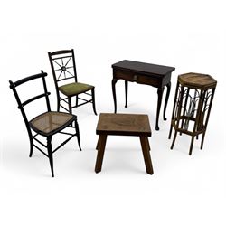Late 19th century black-painted cane seat chair; early 20th century radial spindle-back chair with green upholstery; early 20th century mahogany single-drawer side table; mid-20th century carved wooden stool with harp motif; early 20th century hexagonal bamboo stand; two oval mirrors (7)