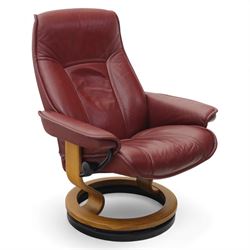 Ekornes - 'Stressless' maroon leather reclining swivel armchair, with high padded back and...