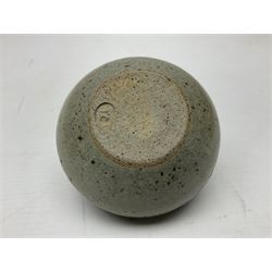 Janet Leach (American, 1918-1997) for Leach Pottery; speckled studio pottery vase of shouldered ovoid form with speckled brown decoration and trailing green and brown glaze upon beige and brown ground, with impressed J.L. monogram and Leach Pottery mark beneath, together with a Jeremy Leach blue speckled lidded circular dish with loop handle, impressed J.L, tallest H11cm