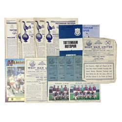 West Ham United - eight 1940s/50s home programmes for 1947/48 - 1951/52 and another for 1986/87 and two team photographs; together with eight Tottenham Hotspur home programmes 1952/53 - 1976/77 (17)
