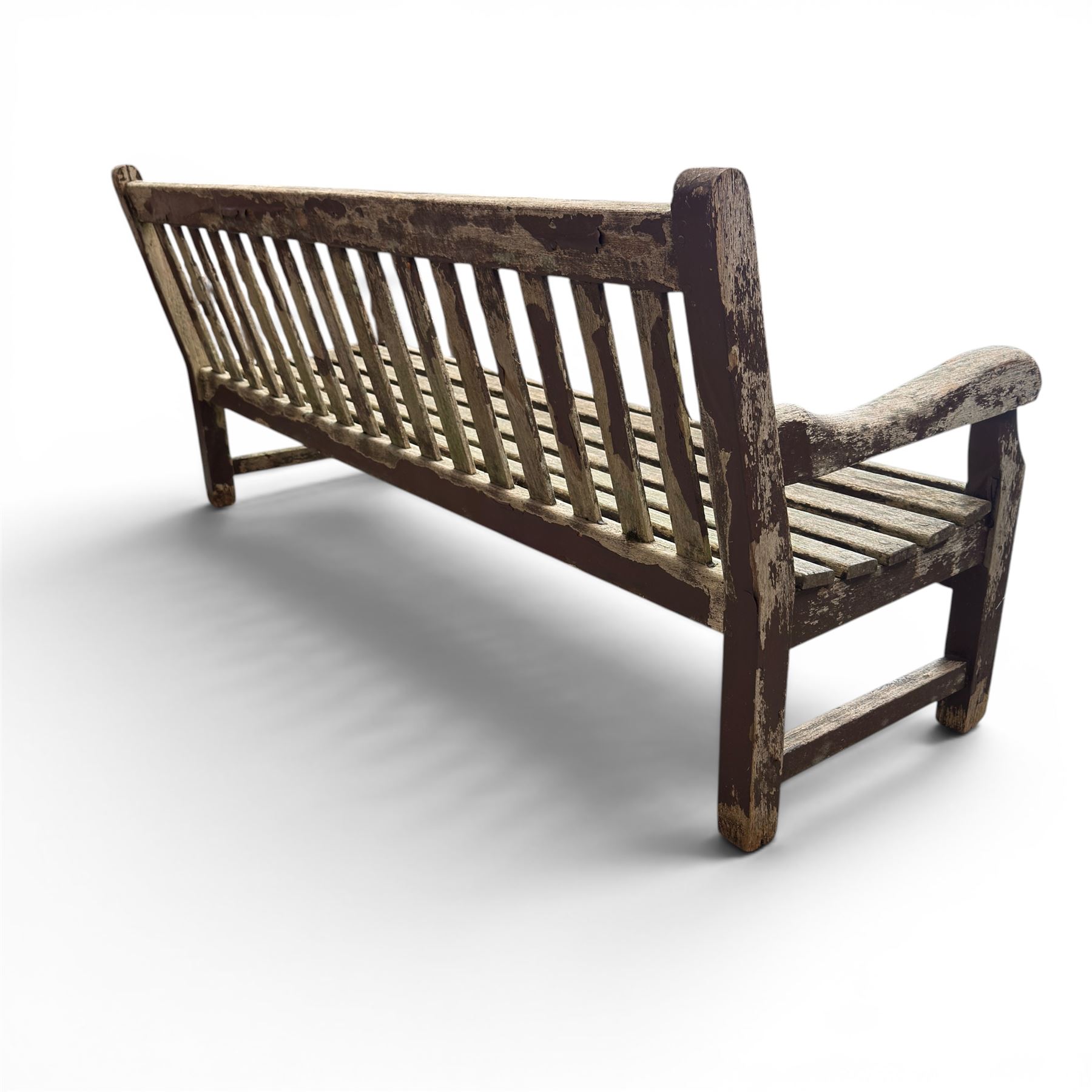 Teak garden bench with slatted back and seat raised on square supports