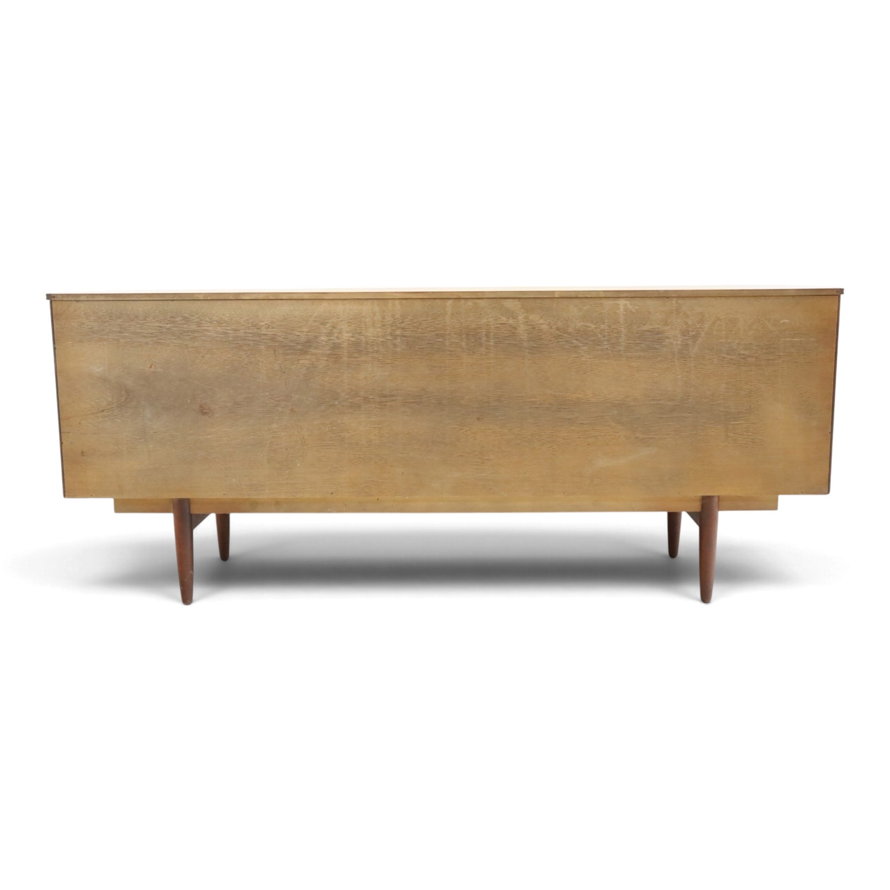 Frank Guille for Austinsuite - mid-20th century teak sideboard, fitted with three central graduating drawers flanked by cupboards, on tapering supports