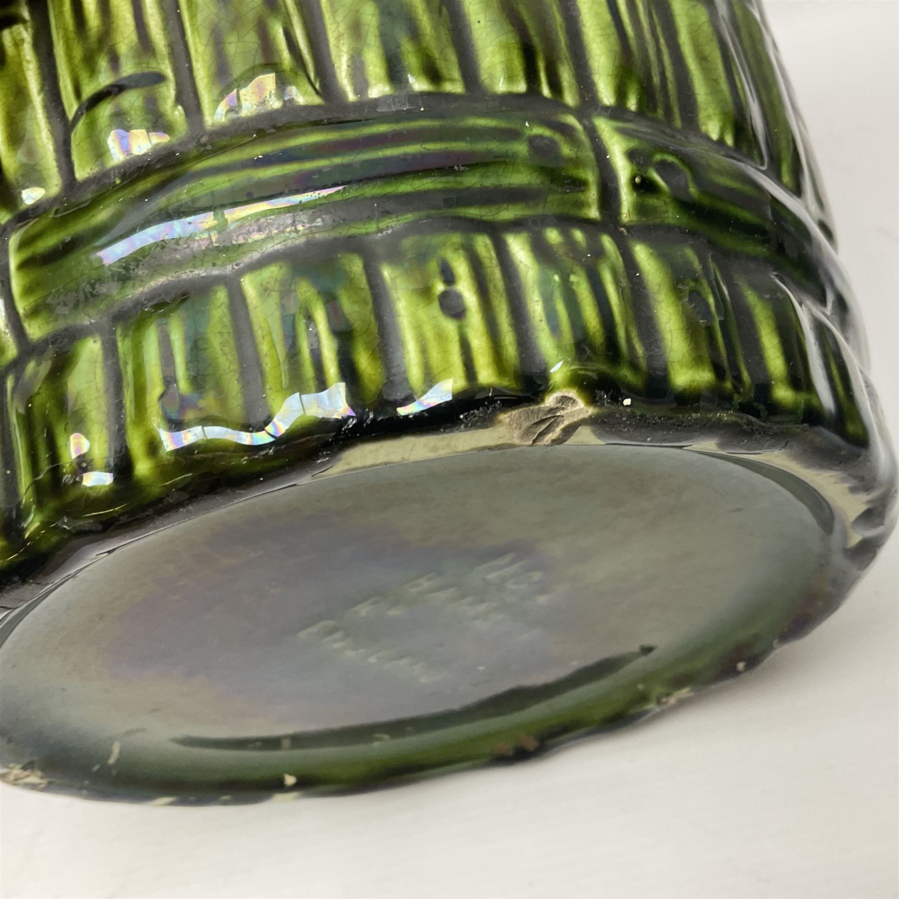 Jardiniere and stand, the jardiniere modelled as a pale, the stand with foliate and foliage decoration on a green ground, stand H73cm 