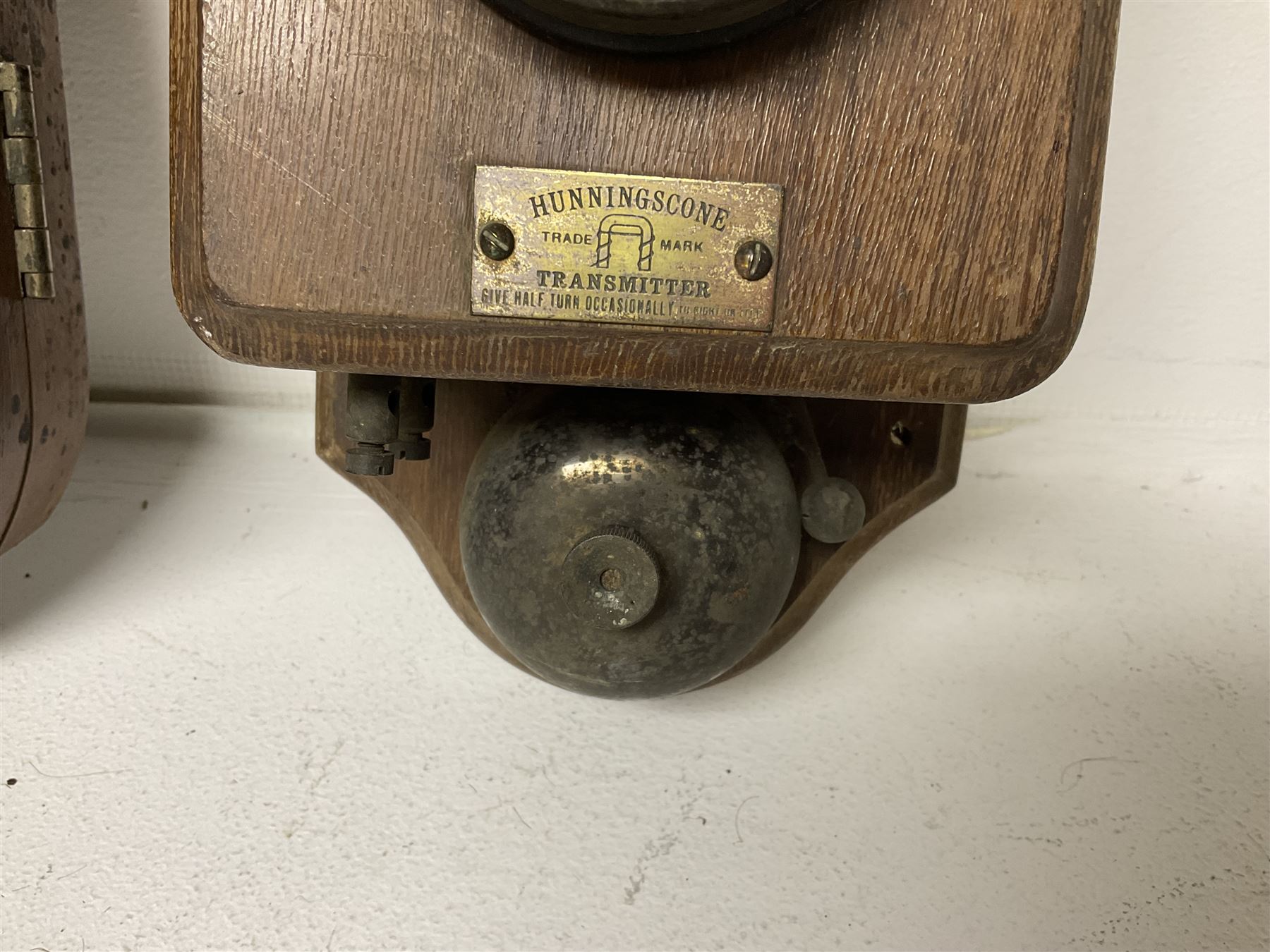 Two Hunningscone patent wall mounting telephones in walnut casing, together with Sterling Telephone & Electric Co. Ltd early wall-mounted telephone 'Primax' and one other 