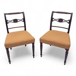 Pair of Regency mahogany side chairs, reeded bar backs centred by oval paterae, overstuffe...