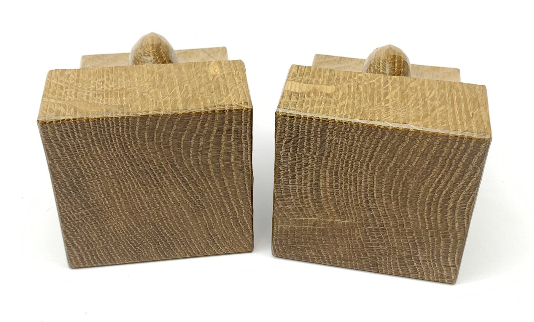 'Mouseman' pair adzed oak bookends by Robert Thompson of Kilburn, carved mouse signature to each end, H16cm