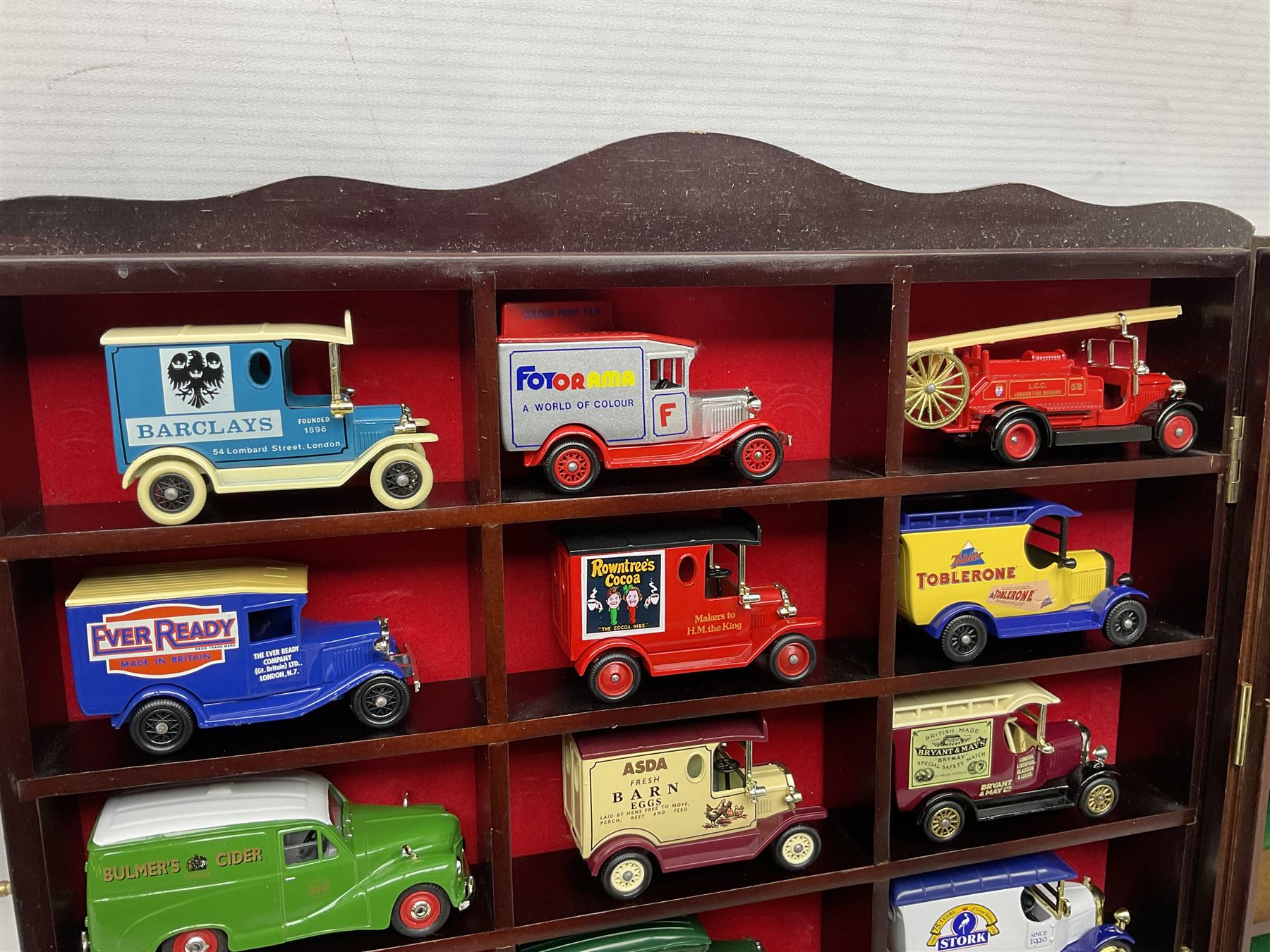 Collection of die-cast vehicles to include Corgi, Dinky, Lledo and Days Gone, housed in six wood display units
